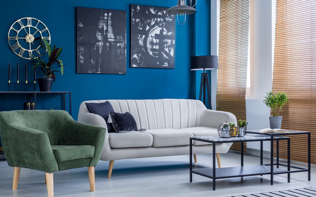 Modern-living-room-have-sofas-and-wall-frames-painted-with-blue-colour